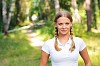 Young beautiful girl in a summer forest