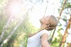 Young beautiful girl in a summer forest