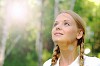 Young beautiful girl in a summer forest