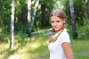 Young beautiful girl in a summer forest