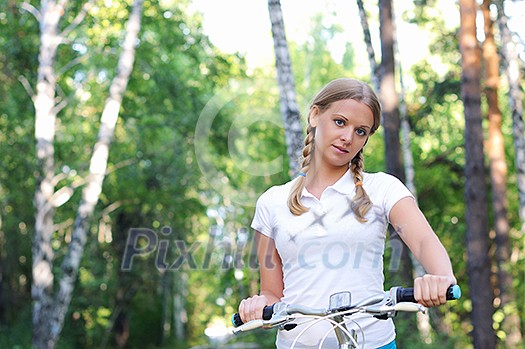 Young beautiful girl in a summer forest Young beautiful girl in a summer forest
