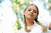 Young beautiful girl in a summer forest