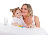 young mother and her young daughter hugged and kissed each other on a white background