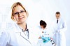 Scientist in uniform doing tests in laboratory