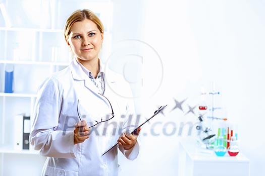 Scientist in uniform doing tests in laboratory Scientist in uniform doing tests in laboratory
