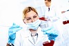 Scientist in uniform doing tests in laboratory