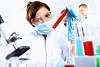 Scientist in uniform doing tests in laboratory