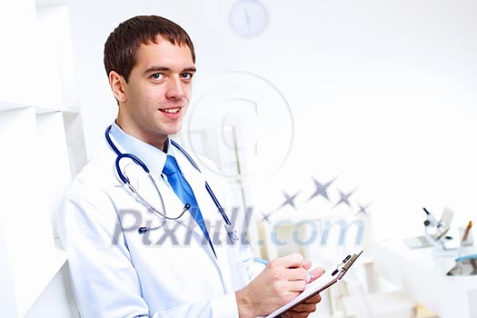 Young confident and friendly doctor in medical office Young confident and friendly doctor in medical office