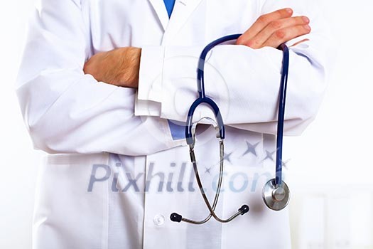 Young confident and friendly doctor in medical office Young confident and friendly doctor in medical office