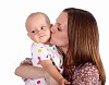 Young mother with little daughter in studio