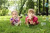 Little girls in the summer park blowing bubbles