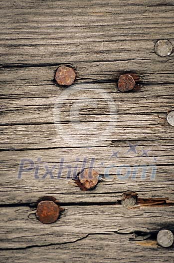 Old rusty nails on wooden background Old rusty nails on wooden background