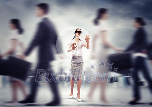 Image of businesswoman in blindfold walking among group of people Image of businesswoman in blindfold walking among group of people