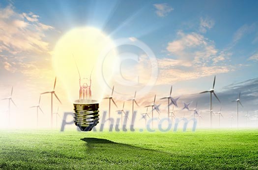 Image of light bulb against nature background. Ecological concept Image of light bulb against nature background. Ecological concept