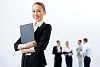 Asian young business woman holding folder with colleagues at background