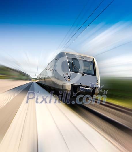 A speeding train leaving a train platform