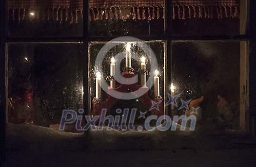 electric candlestick in frosty window electric candlestick in frosty window