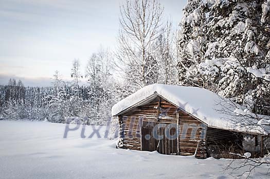 A old barn in a winter landscape A old barn in a winter landscape