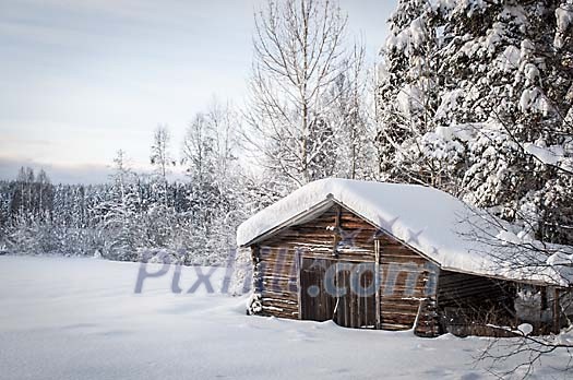 A old barn in a winter landscape