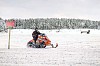 A man riding a snowmobile in a snowy landscape