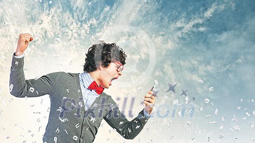 Young businessman with a red tie shouting furiously at his mobile phone