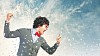 Young businessman with a red tie shouting furiously at his mobile phone