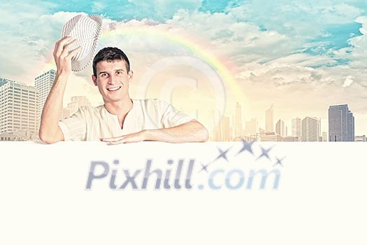 Young handsome man with blank banner. Place for text Young handsome man with blank banner. Place for text