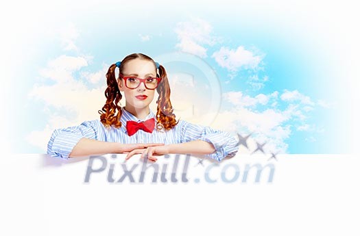 Young woman holding a blank white billboard Young woman holding a blank white billboard