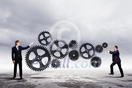 Businessmen with cog wheel elements. Construction concept Businessmen with cog wheel elements. Construction concept