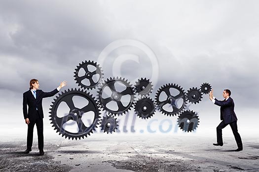 Businessmen with cog wheel elements. Construction concept