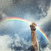 Close-up image of human hand clenching rainbow