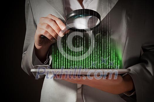 Businesswoman with magnifier glass examining binary code