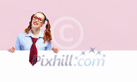 Young woman holding a blank white billboard Young woman holding a blank white billboard