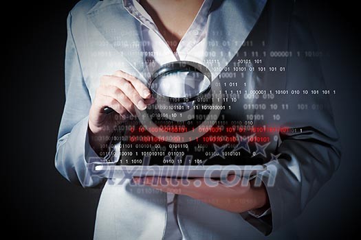 Businesswoman with magnifier glass examining binary code Businesswoman with magnifier glass examining binary code
