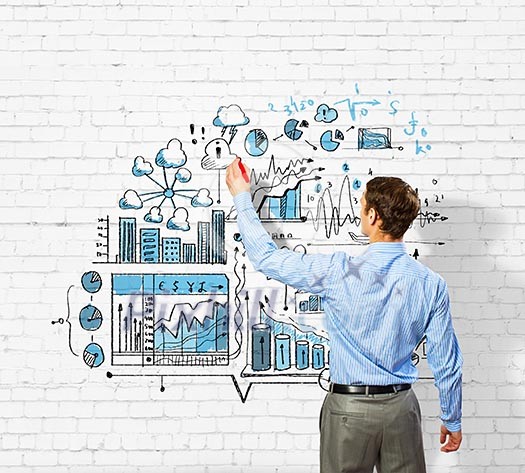 Back view image of businessman drawing sketches on wall