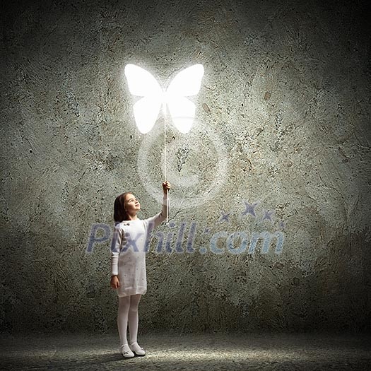 Image of little cute girl holding butterfly balloon