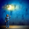 Image of little cute girl with moon on rope