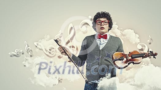Image of young handsome man playing violin