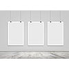 Three white blank banners hanging on wall. Place for text
