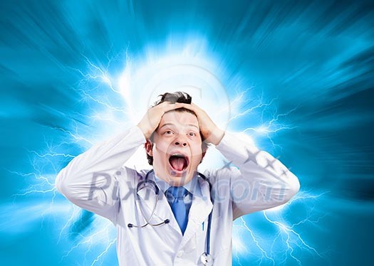 Young mad doctor in white uniform screaming