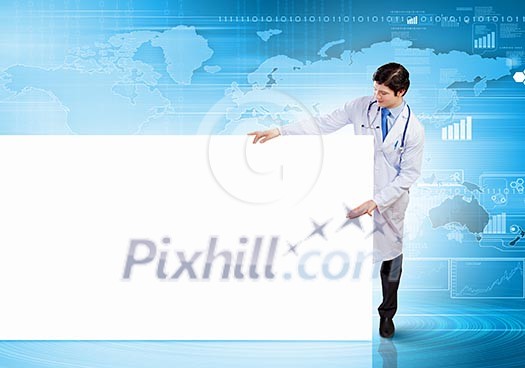 Young male doctor with blank banner. Place for text Young male doctor with blank banner. Place for text
