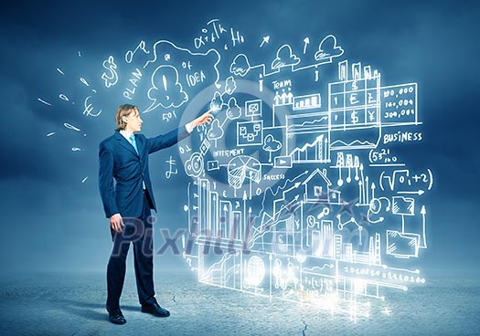 Image of young businessman standing against business sketch Image of young businessman standing against business sketch