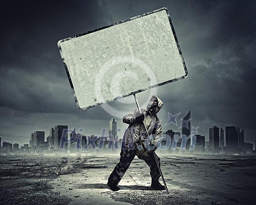 Stalker in gas mask with blank banner. Disaster concept Stalker in gas mask with blank banner. Disaster concept