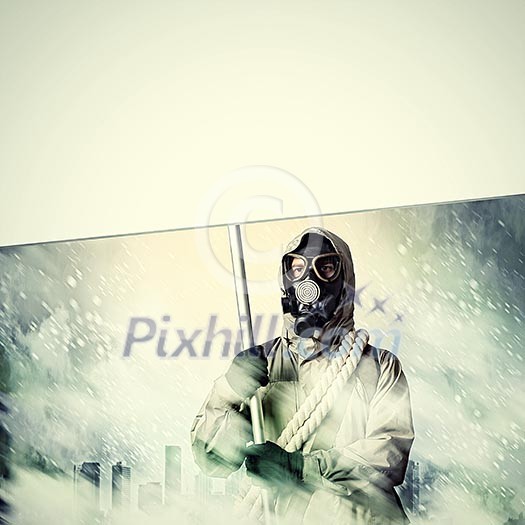 Stalker in gas mask with blank banner. Disaster concept