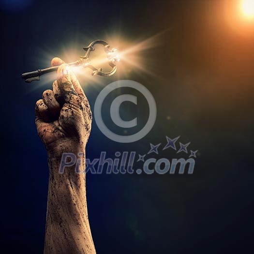 Key in human hand. Struggle and success