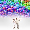 Image of young couple holding bunch of colorful balloons
