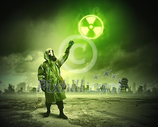 Man in respirator against nuclear background. Radioactivity concept Man in respirator against nuclear background. Radioactivity concept