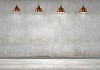 Blank cement wall with place for text illuminated by lamps above