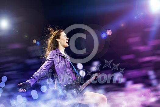 Young attractive rock girl playing the electric guitar Young attractive rock girl playing the electric guitar