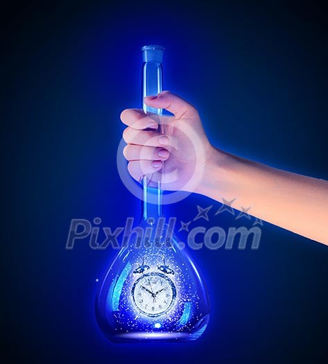 Human hand holding test tube with alarm clock inside Human hand holding test tube with alarm clock inside